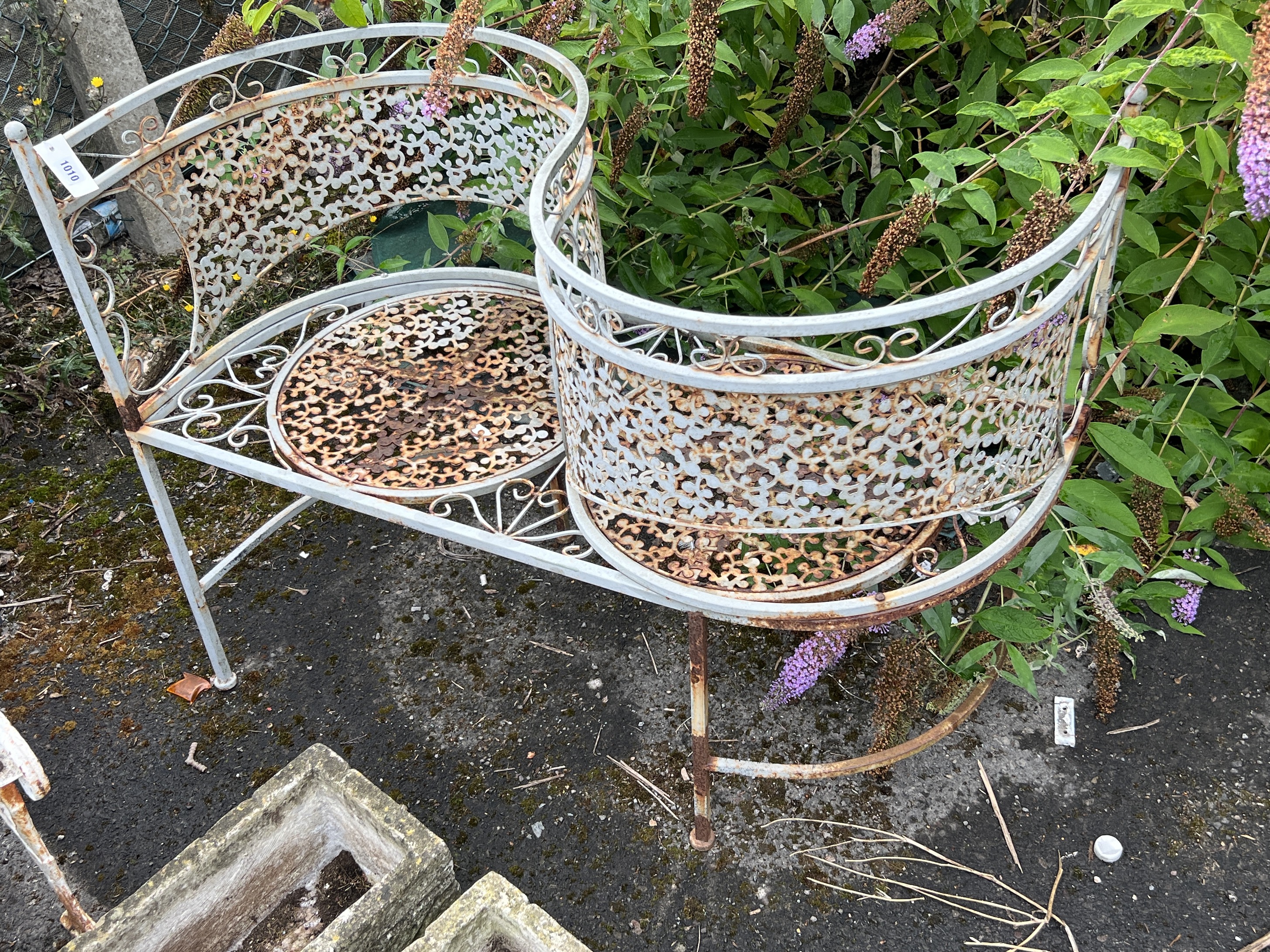 A painted metal garden 'love seat', length 110cm, width 48cm, height 82cm